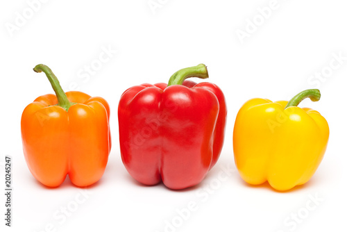 peppers in a row on white background