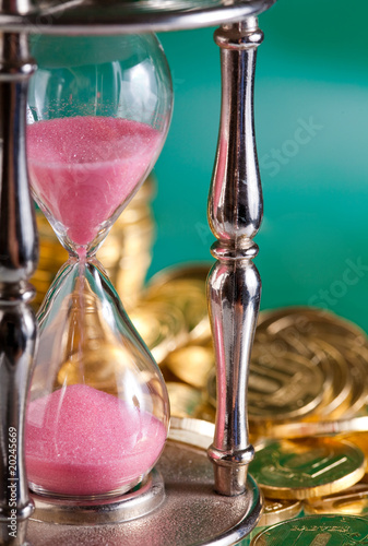 hourglass and coins
