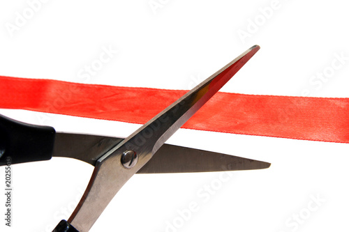 scissors cutting a red ribbon. photo