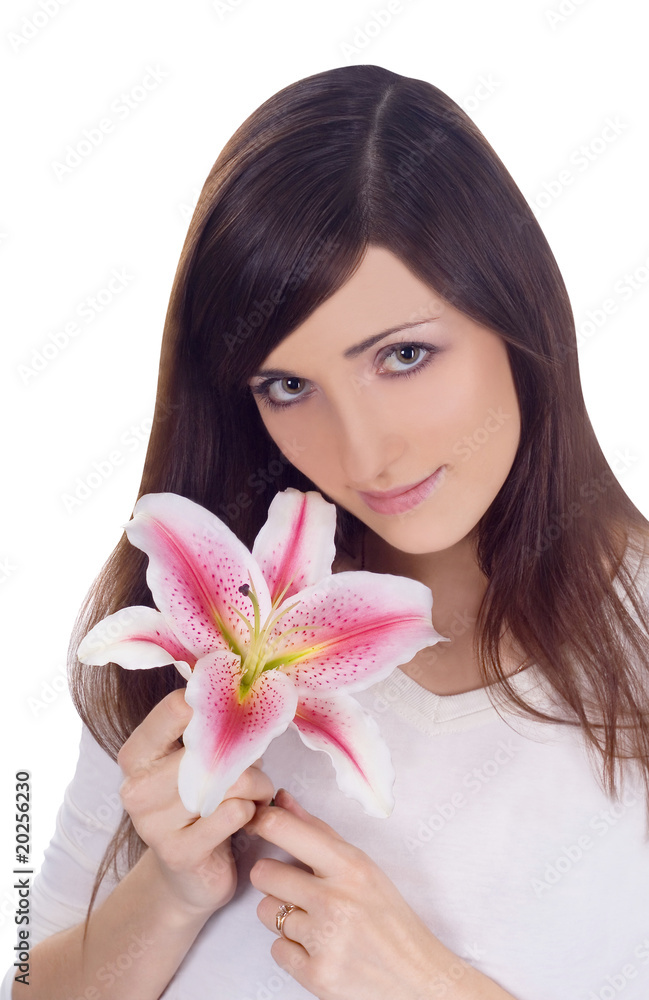 Brightly portrait of young lovely brunette with flower in hands Brightly portrait of young lovely brunette with flower in hands