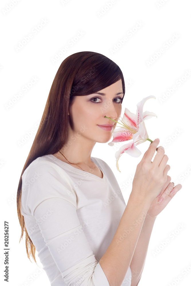 Brightly portrait of young lovely brunette with flower in hands Brightly portrait of young lovely brunette with flower in hands