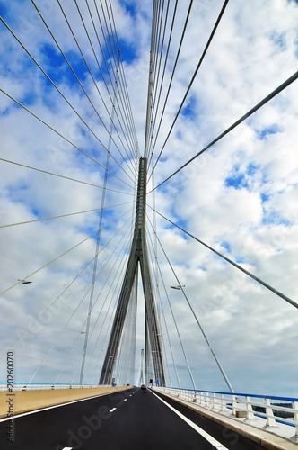 cable-stayed bridge in the background of blue sky with clouds
