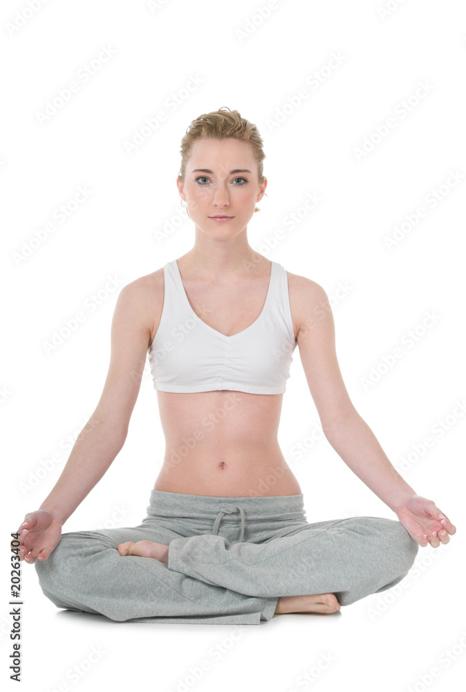 Young woman doing yoga, easy / Sukhasana position Young woman doing yoga, easy / Sukhasana position