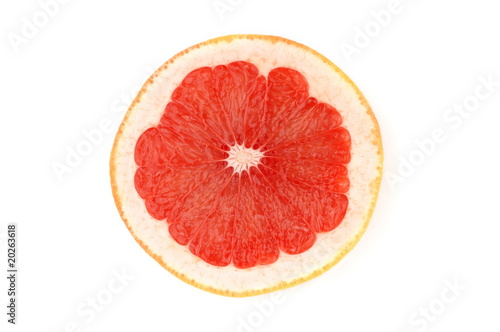 Single grapefruit slice isolated on white background