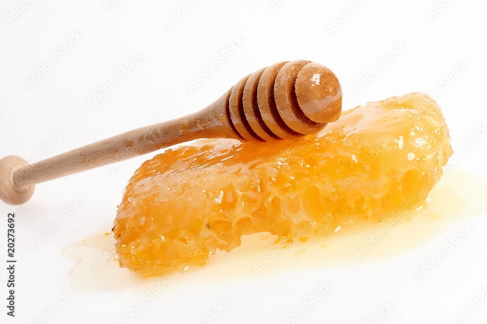 Honeycomb, wooden stick isolated on white Honeycomb, wooden stick isolated on white