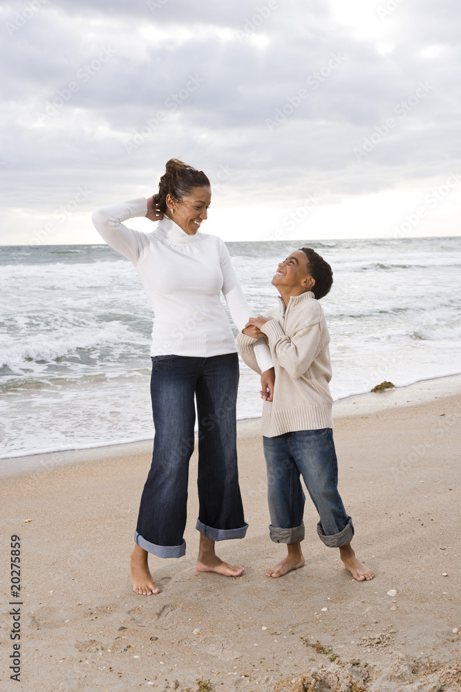 African-American mother and son at beach