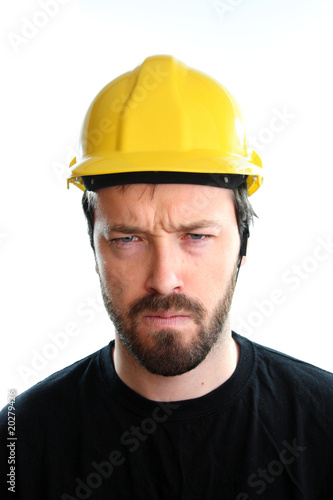 Angry worker in yellow helmet
