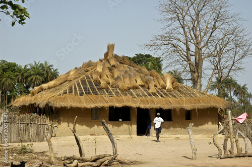 changing thatch on an african house