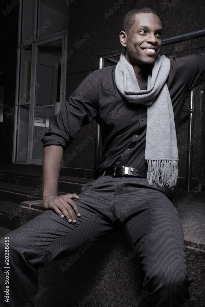 African American man smiling and wearing a scarf African American man smiling and wearing a scarf