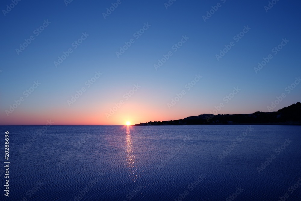 Beautiful sunset sunrise over blue sea ocean red  sky
