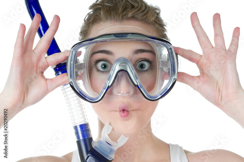 Surprised young woman, scuba mask and snorkel, makes funny fish