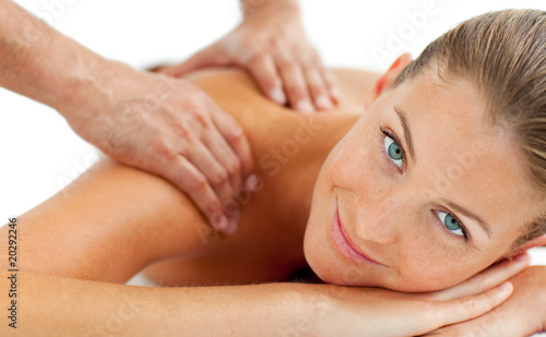 Smiling woman enjoying a massage photo