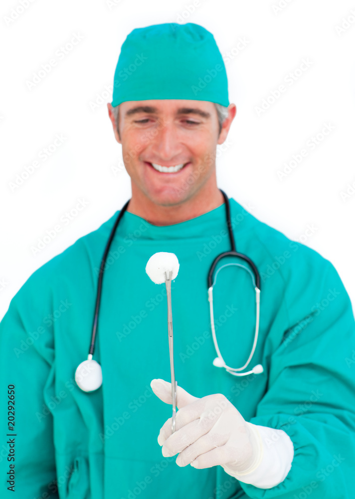 Confident surgeon holding surgical forceps Confident surgeon holding surgical forceps