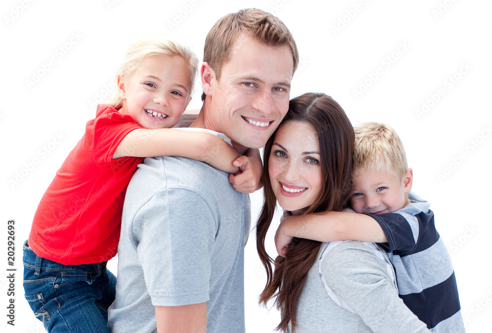 Portrait of joyful family enjoying piggyback ride against a whit