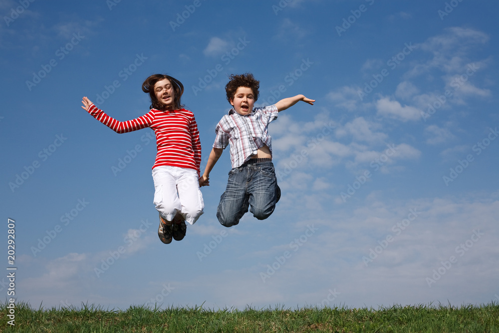 Girl and boy jumping, running outdoor Girl and boy jumping, running outdoor
