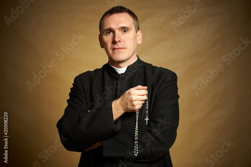 Young priest Fototapet