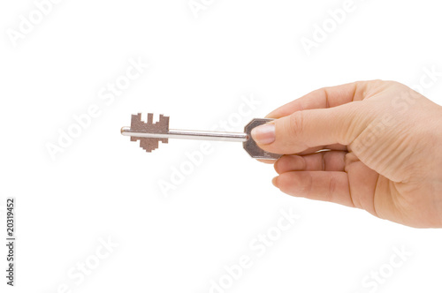 Key in a hand isolated on white background © Vladimir Voronin