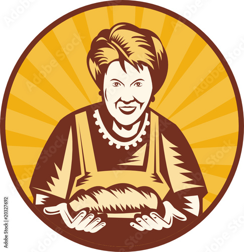 Grandma baker showing off loaf of bread