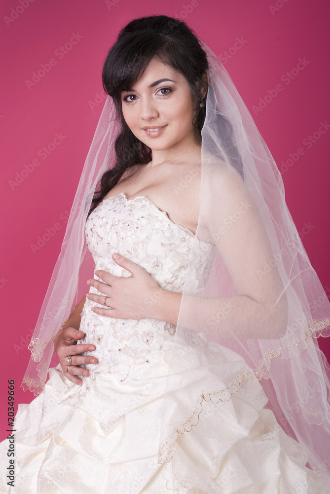 studio portrait of a happy bride on a pink background studio portrait of a happy bride on a pink background
