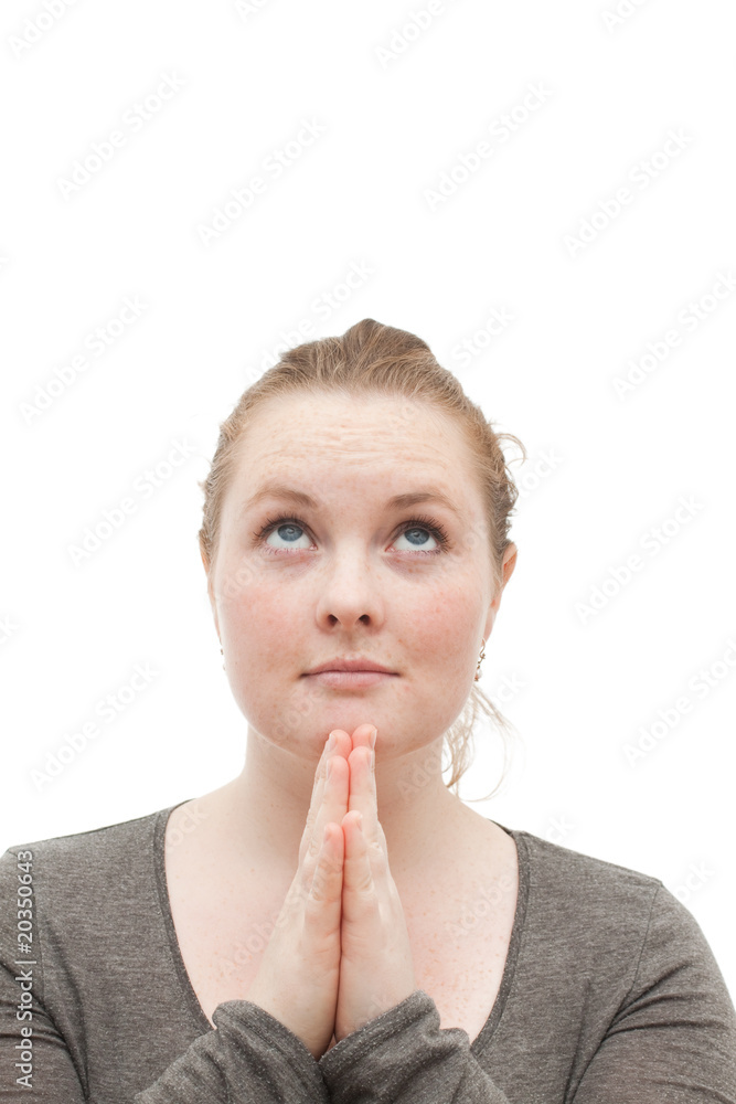 Young religious woman praying to god on white Young religious woman praying to god on white