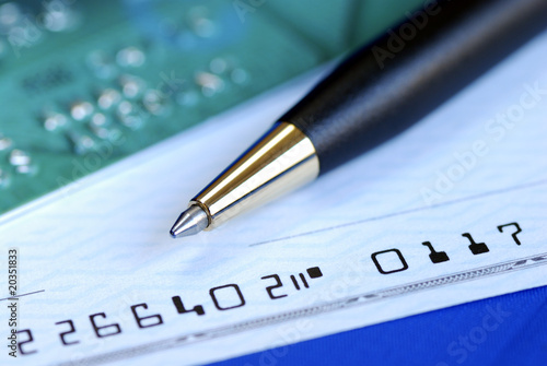 Write a check to pay the credit card bill isolated on blue