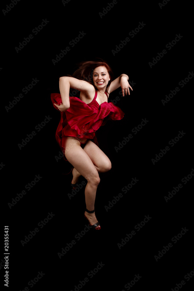 Woman in red dress dancing
