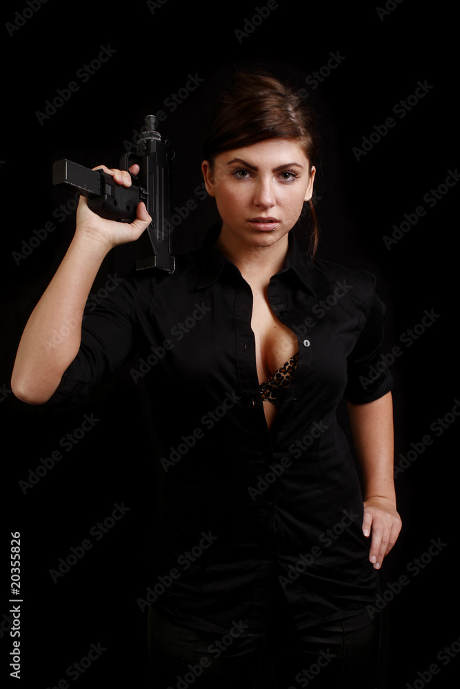 sexy woman with an automatic pistol dressed in black sexy woman with an automatic pistol dressed in black