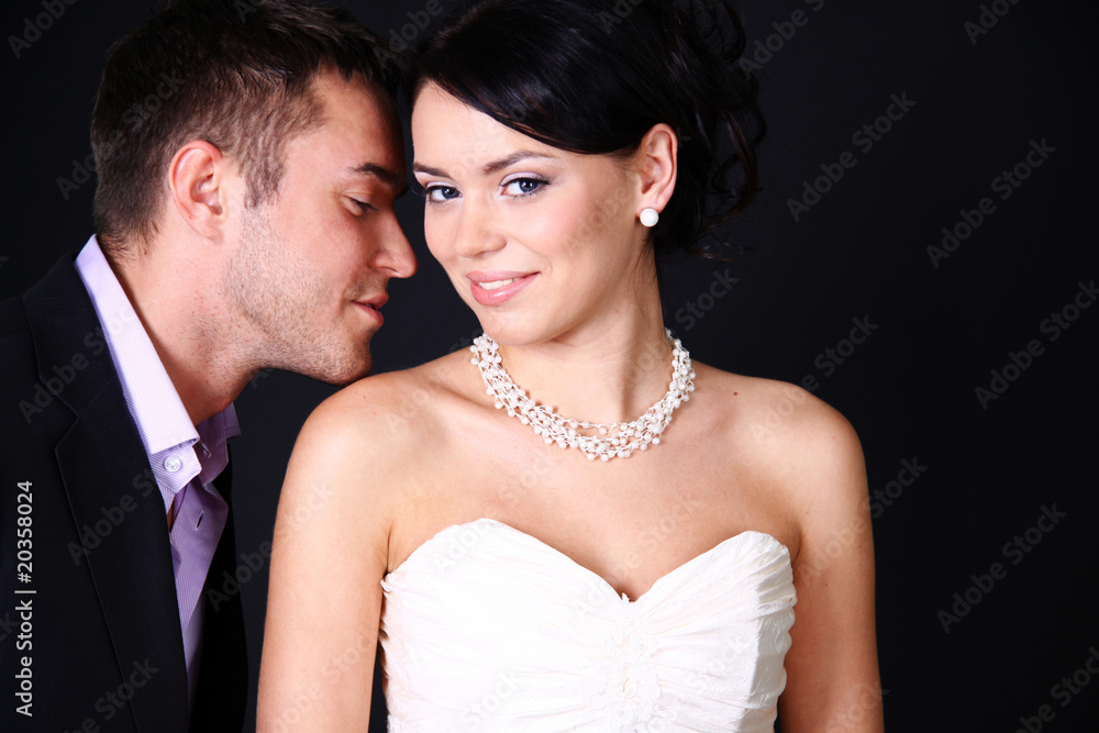 Loving couple standing in the studio Loving couple standing in the studio