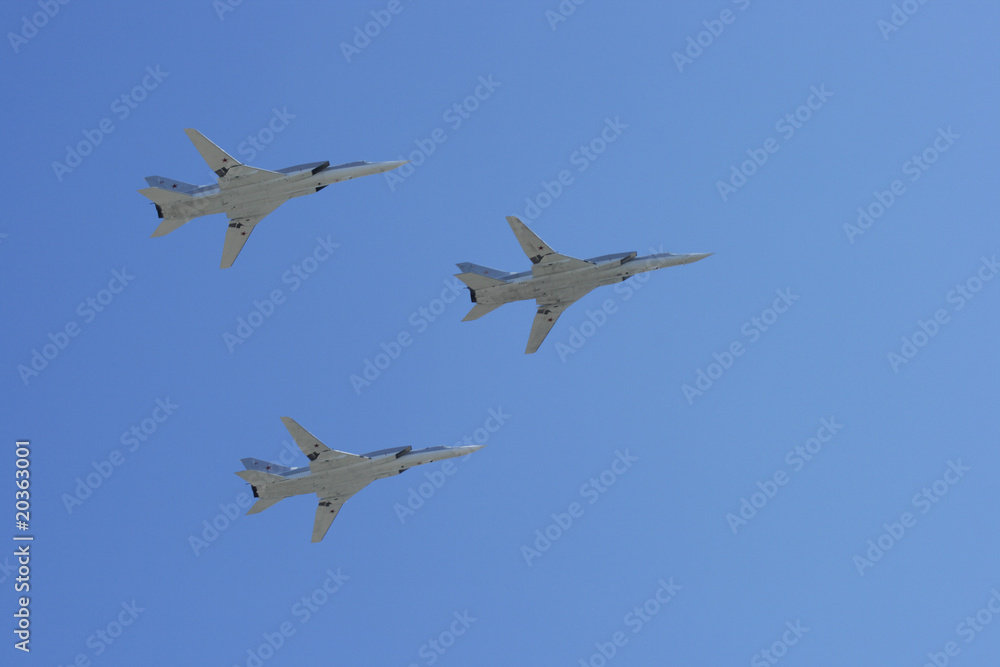 The group of planes against the dark blue sky The group of planes against the dark blue sky