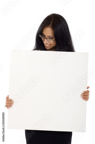 Young woman holding blank sign