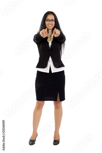 Young smiling business woman pointing