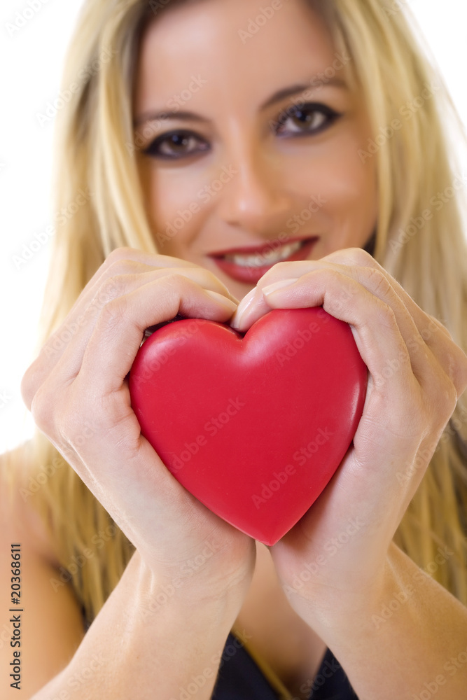 woman holding a red heart - closeup woman holding a red heart - closeup