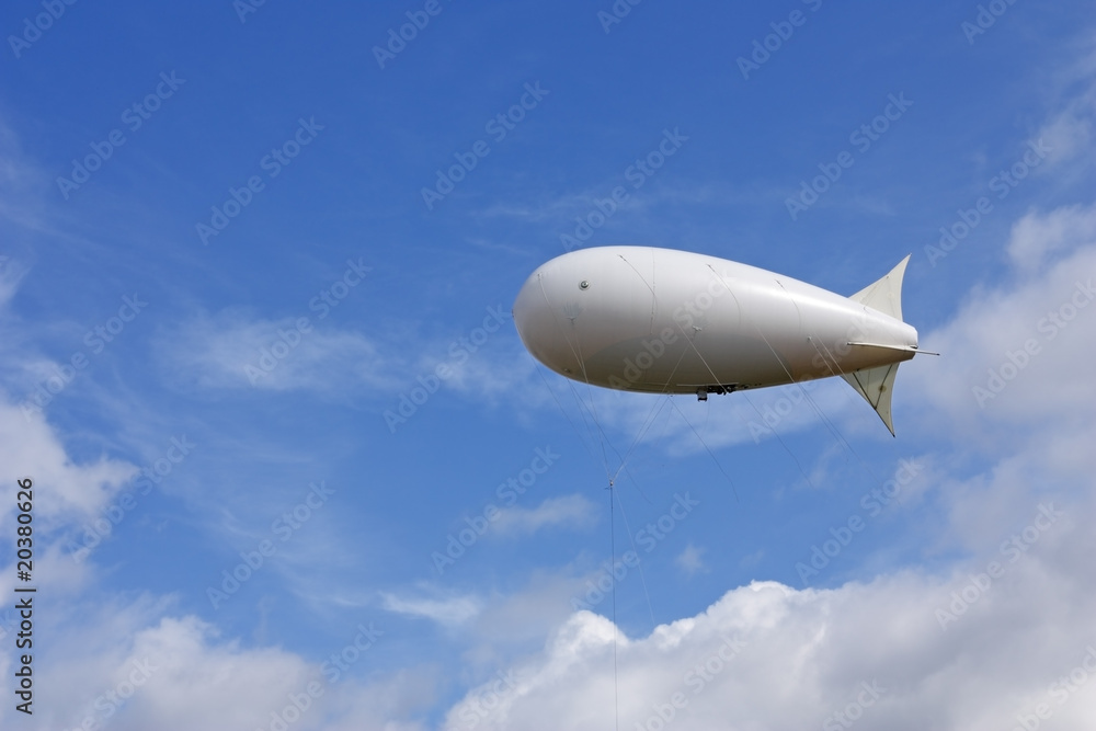 White balloon against the blue sky and clouds White balloon against the blue sky and clouds