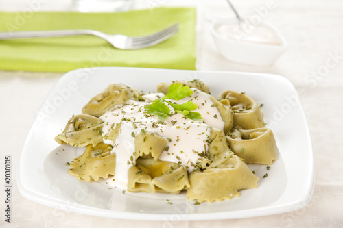 dish of tortellini with cheese sauce