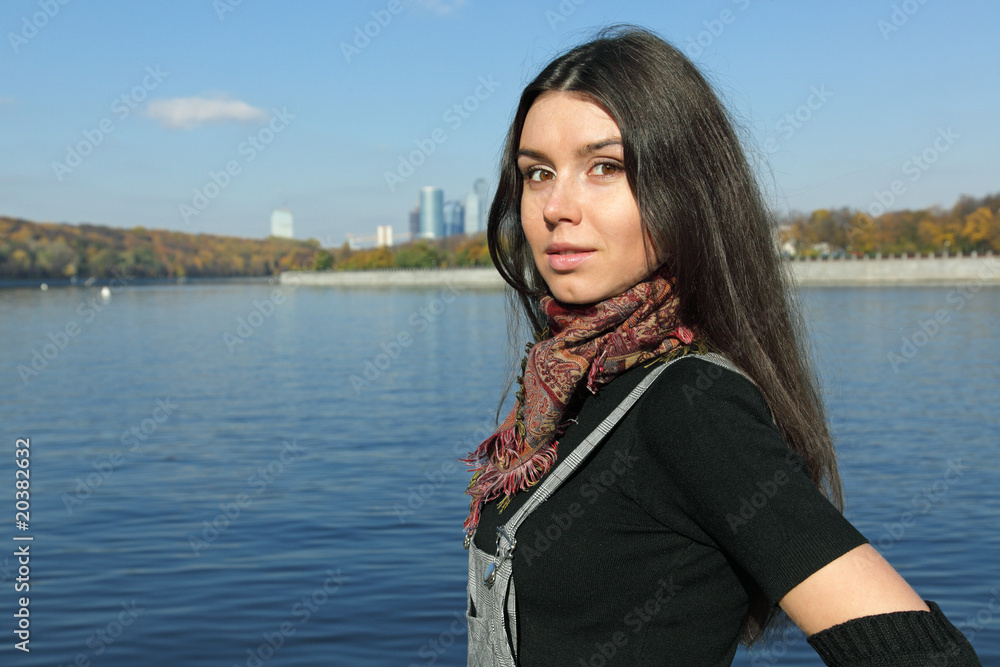 The beautiful girl stand on river bank Moscow The beautiful girl stand on river bank Moscow
