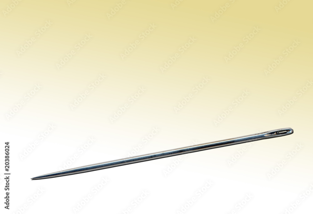 Steel needle on a yellow background Steel needle on a yellow background
