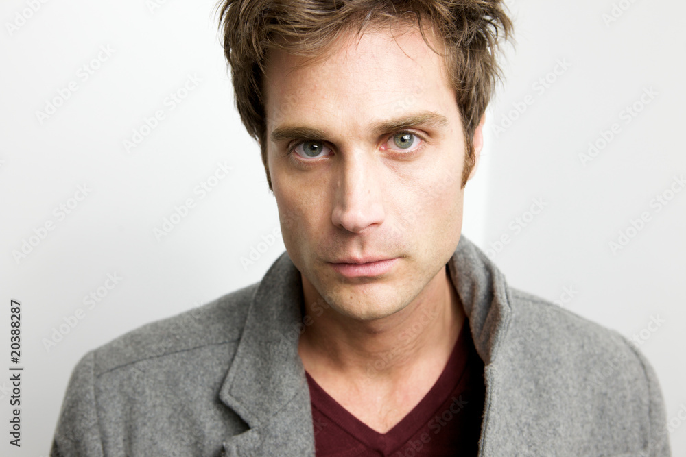 Attractive Young Man looking sternly at camera Attractive Young Man looking sternly at camera