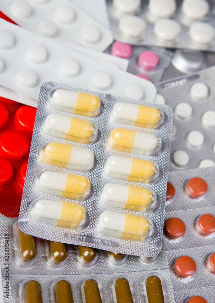 Packings of medical pills and tablets.