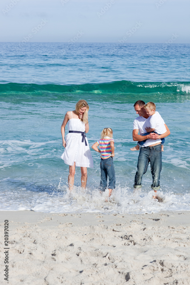 Cheerful family having fun at the beach
