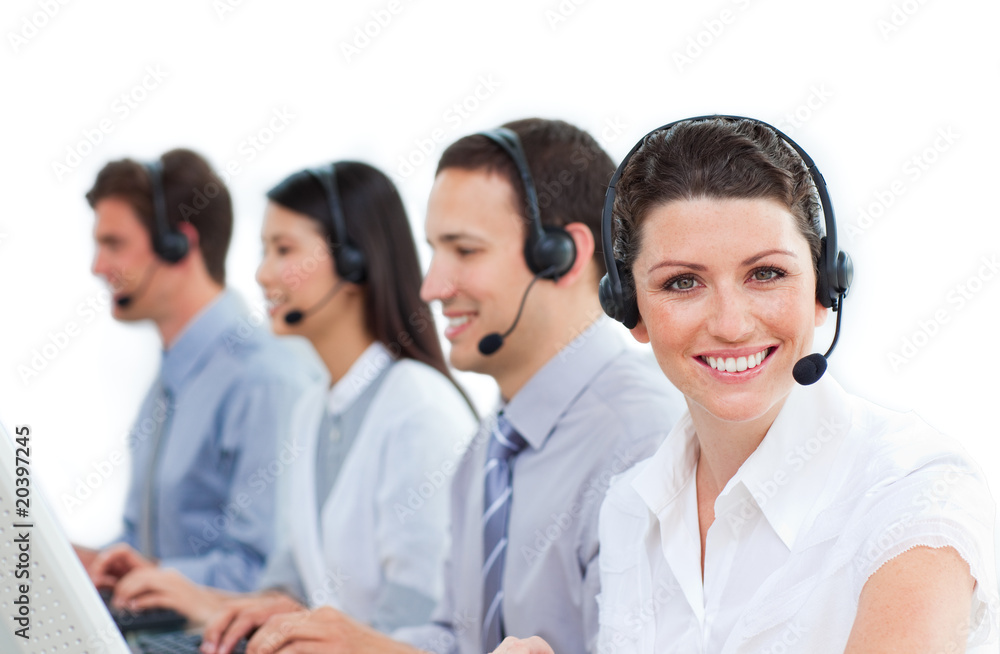 Multi-ethnic business team talking on headset Multi-ethnic business team talking on headset