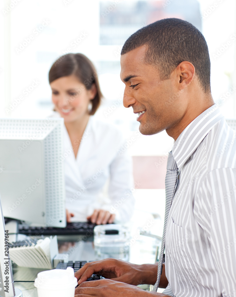 Fototapeta premium Two positive colleagues working at a their computer