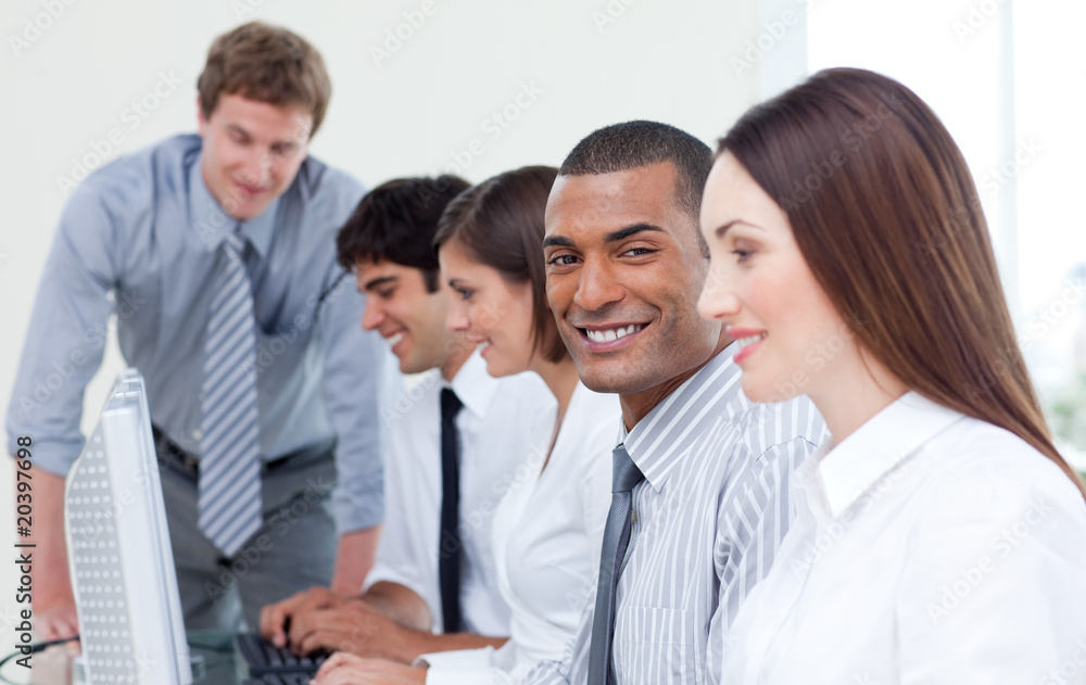 Enthusiastic business team working at computer Enthusiastic business team working at computer