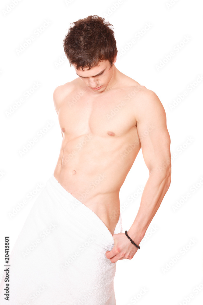 Young, handsome man overwraped by towel