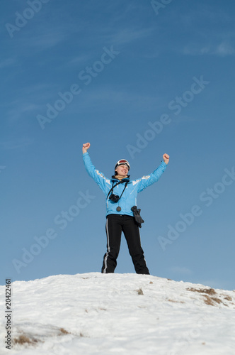 Girl skier on the mountain peak © Kateryna Moskalenko
