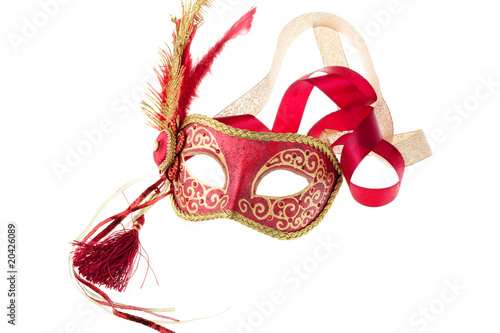 red and gold feathered carnival mask isolated on a white