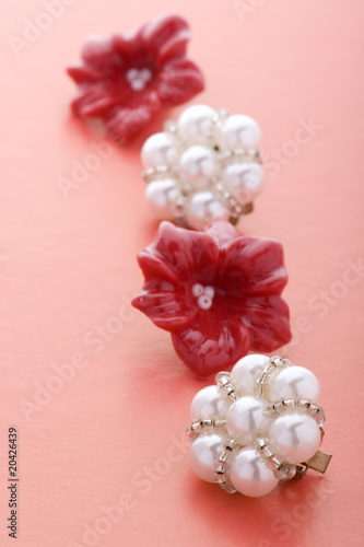 costume jewel earrings on red