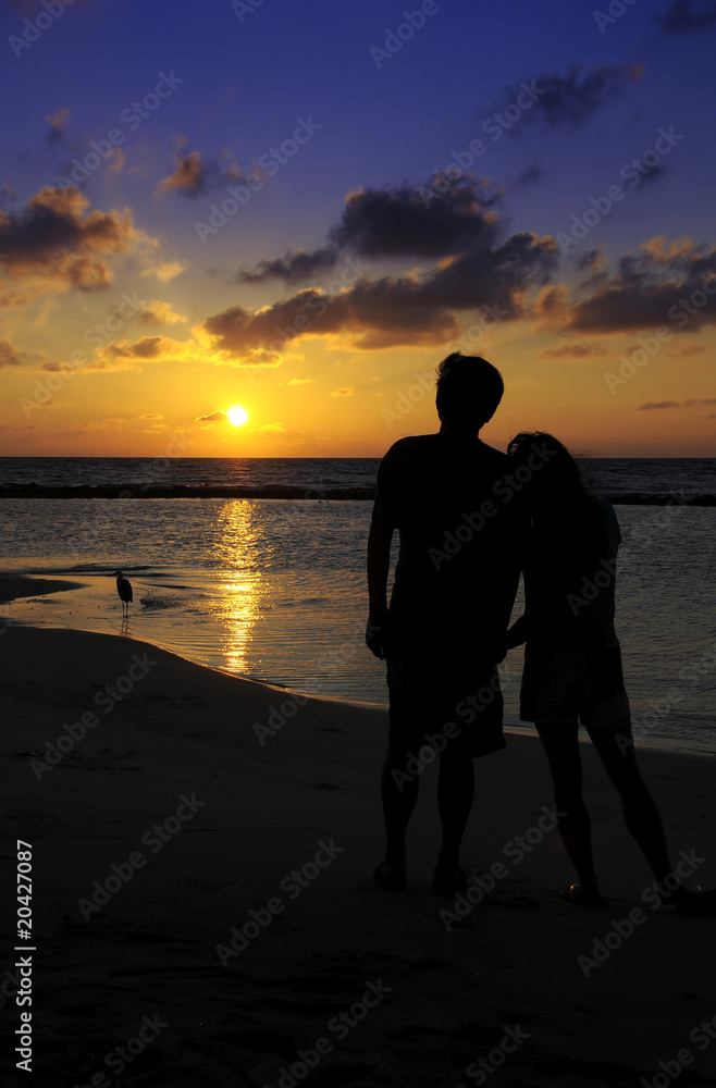 Couples figure with sunset background