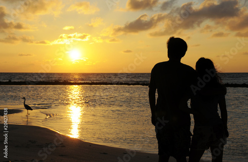 Couples figure with sunset background