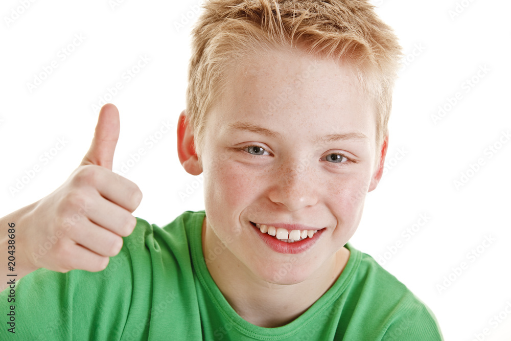Young boy showing thumb up symbolizing success Young boy showing thumb up symbolizing success