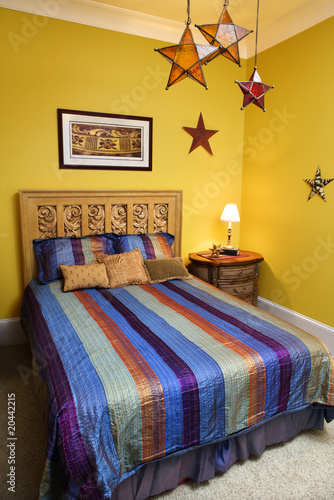 Bedroom Interior With Striped Bedspread and Decorative Stars